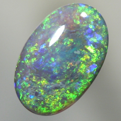 SOLID SEMI BLACK OPAL Sparkling green in a 3 dimensional pattern over blue